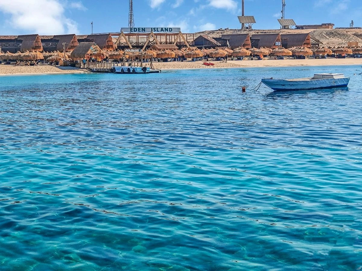 Book Eden Island Hurghada private boat trip with Orange Bay beach time, snorkeling, a White Sandbank stop, fresh fruit and optional hotel transfer.