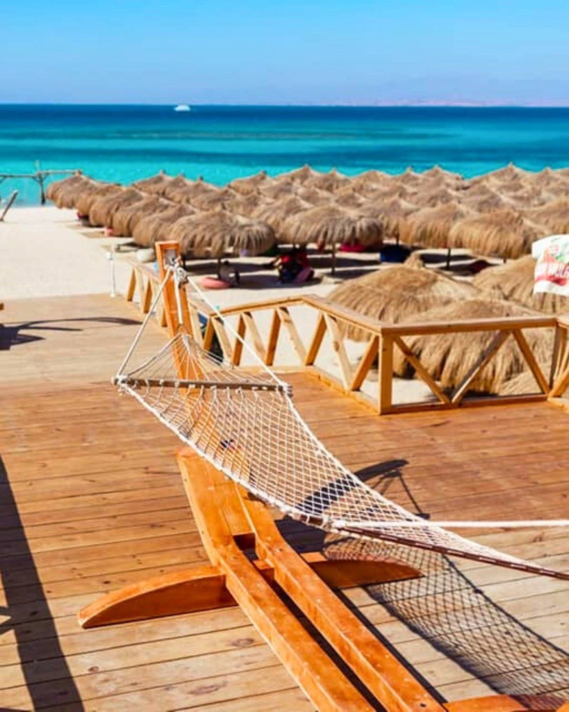Enjoy a private Hula Hula Island trip from Hurghada with beach time, snorkeling, clear water, soft drinks, and a fun island experience.