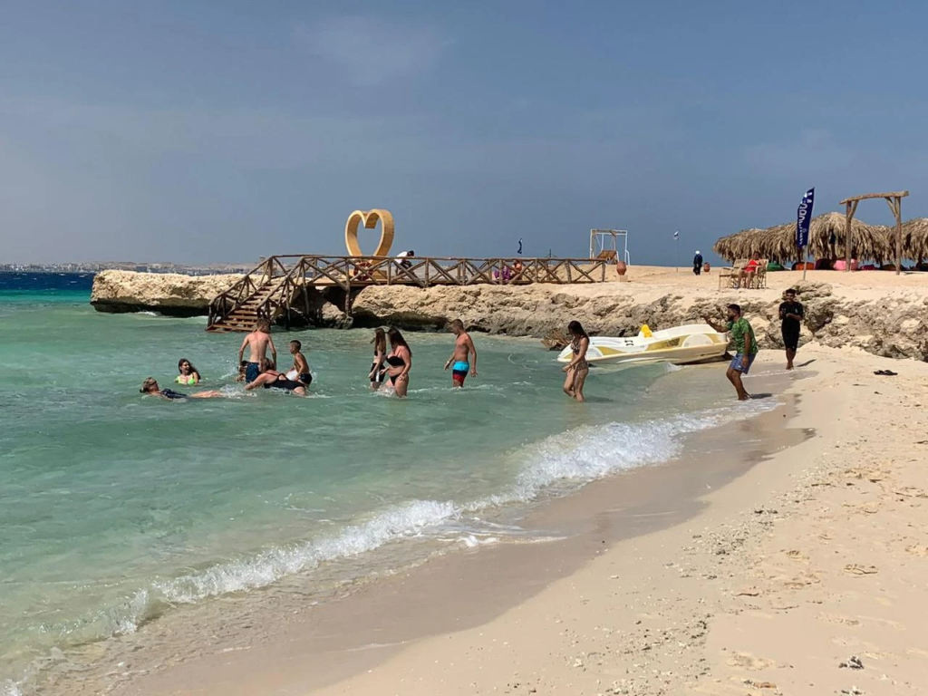 Discover Magawish Island on a private boat trip with snorkeling, white sand, calm turquoise water, fresh fruit, and a relaxing Red Sea escape.