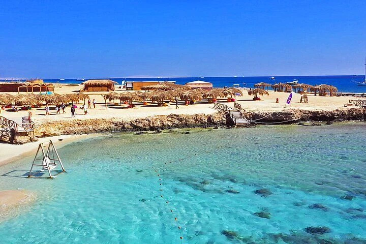 Discover Magawish Island on a private boat trip with snorkeling, white sand, calm turquoise water, fresh fruit, and a relaxing Red Sea escape.