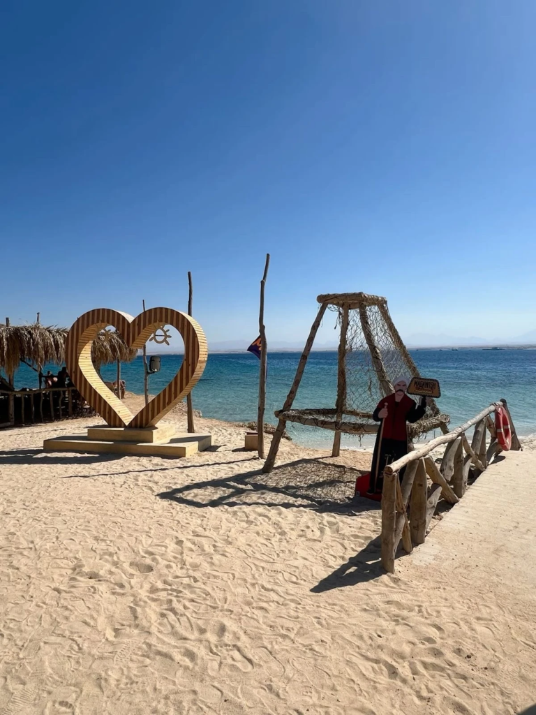 Discover Magawish Island on a private boat trip with snorkeling, white sand, calm turquoise water, fresh fruit, and a relaxing Red Sea escape.
