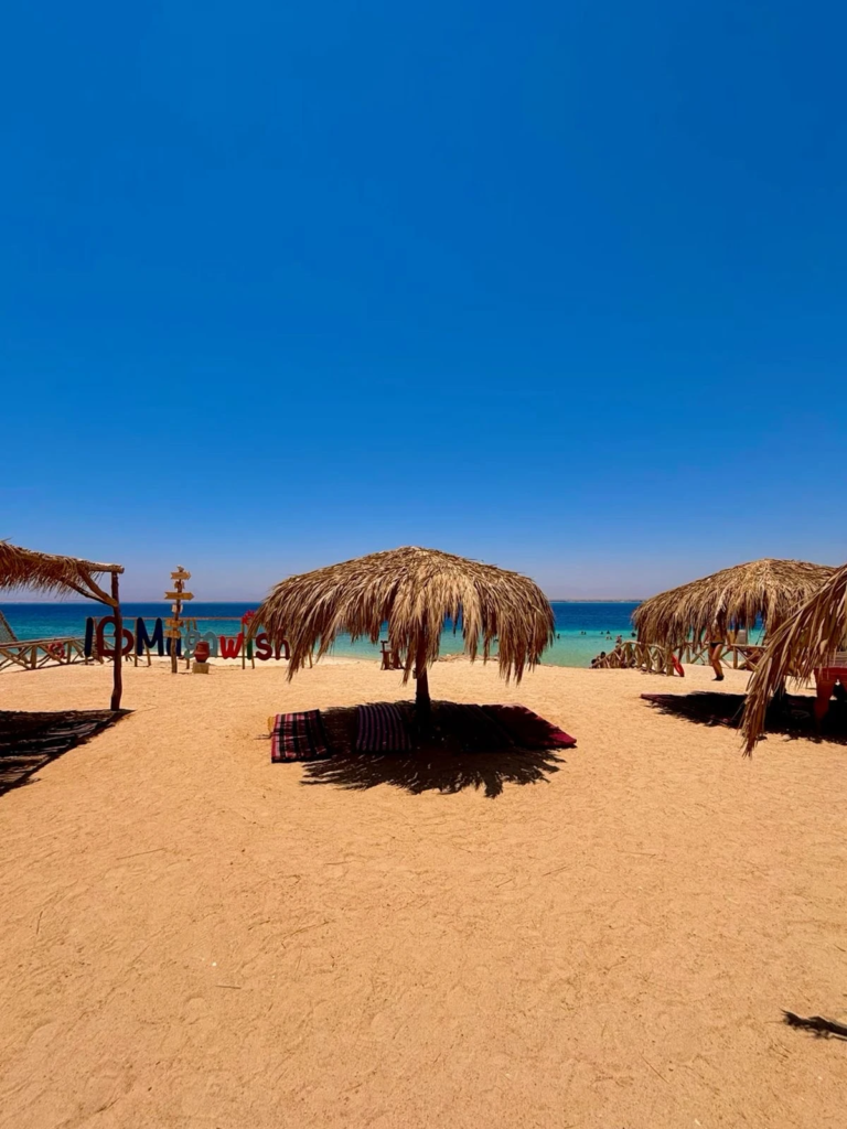 Discover Magawish Island on a private boat trip with snorkeling, white sand, calm turquoise water, fresh fruit, and a relaxing Red Sea escape.