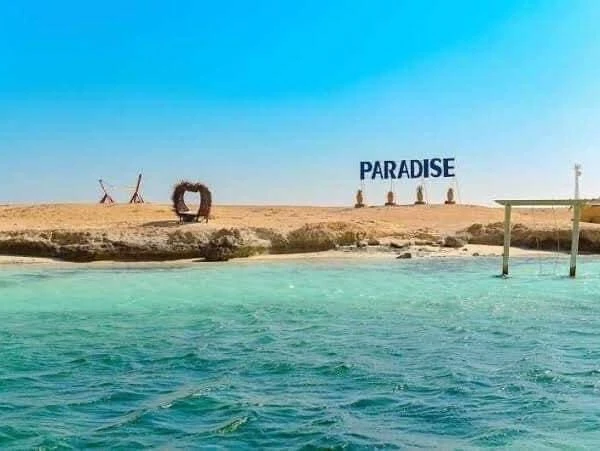 Visit Paradise Island from Hurghada on a private boat trip with snorkeling, beach relaxation, crystal-clear water, and beautiful Red Sea views.