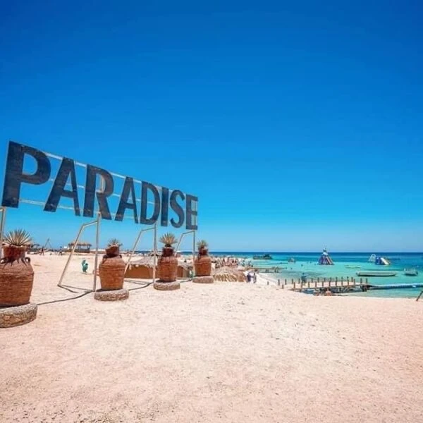 Visit Paradise Island from Hurghada on a private boat trip with snorkeling, beach relaxation, crystal-clear water, and beautiful Red Sea views.