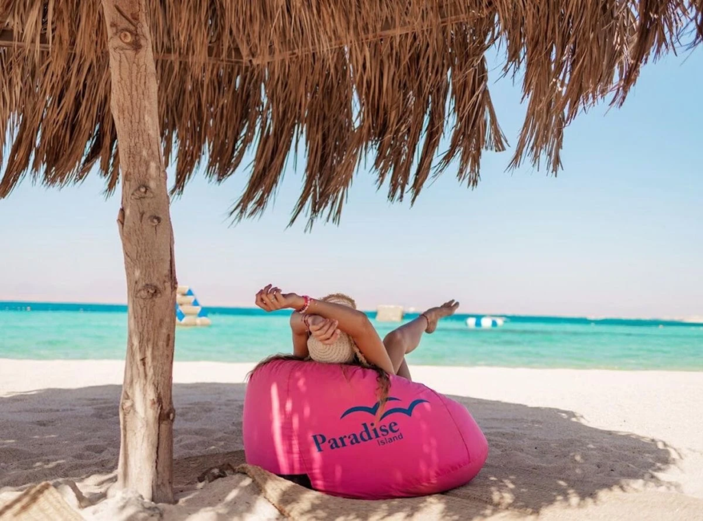 Visit Paradise Island from Hurghada on a private boat trip with snorkeling, beach relaxation, crystal-clear water, and beautiful Red Sea views.