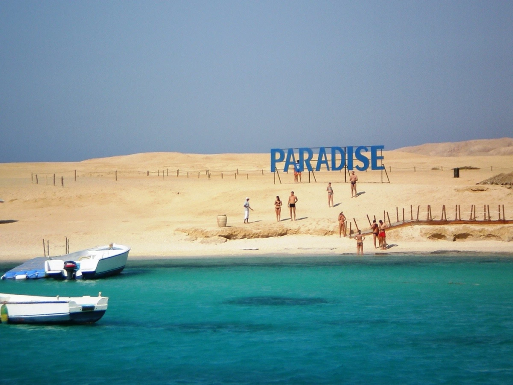 Visit Paradise Island from Hurghada on a private boat trip with snorkeling, beach relaxation, crystal-clear water, and beautiful Red Sea views.