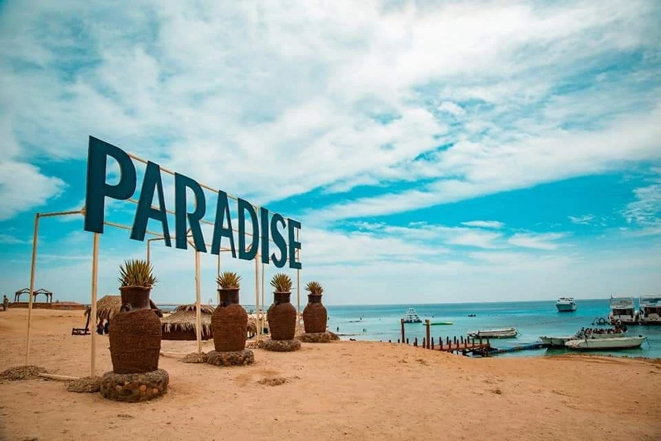 Visit Paradise Island from Hurghada on a private boat trip with snorkeling, beach relaxation, crystal-clear water, and beautiful Red Sea views.