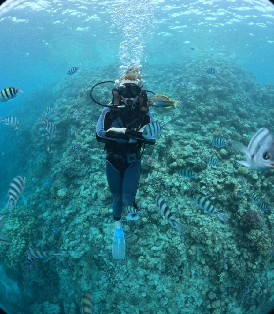 Experience scuba diving in Hurghada with professional guidance, diving equipment, colorful coral reefs, tropical fish, and beautiful Red Sea underwater views.